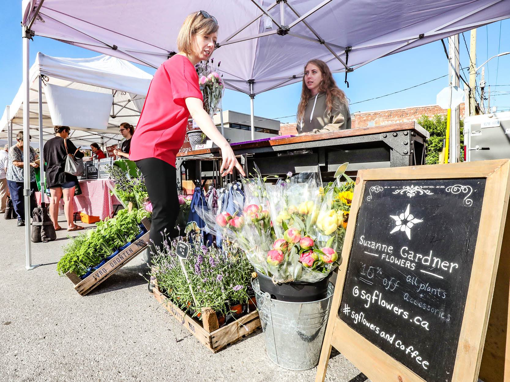Woman buying flowers at a market